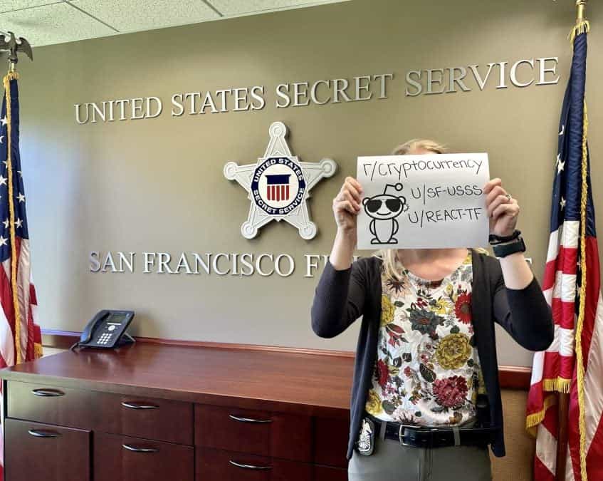 A US Secret Service agent holds a Reddit verification message.